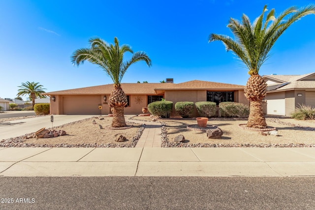 ranch-style home with a garage