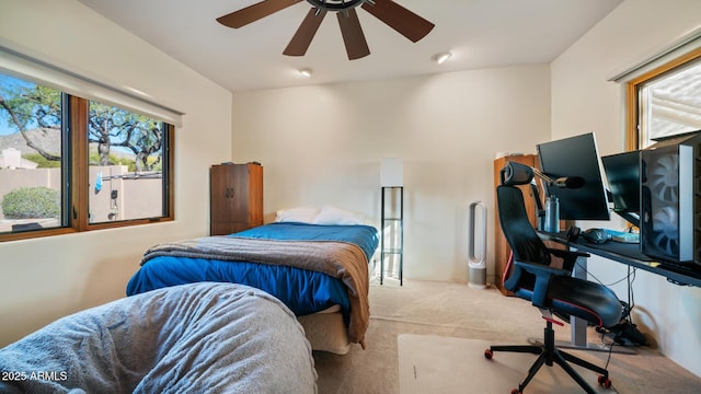 carpeted bedroom featuring ceiling fan