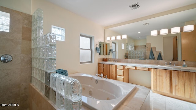 bathroom with independent shower and bath and vanity