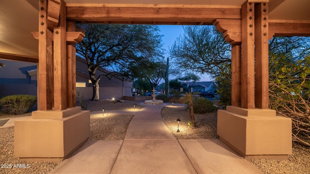 view of patio terrace at dusk