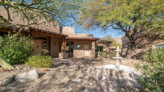 back of property with a patio area