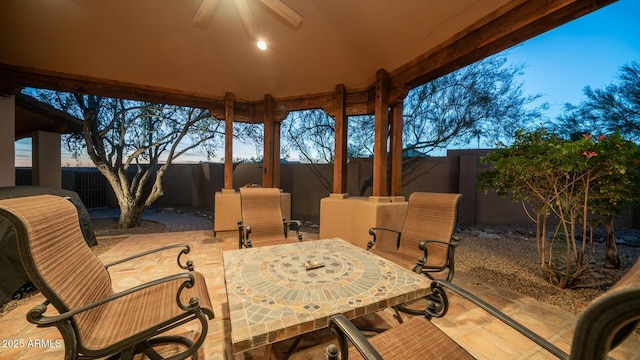 patio terrace at dusk with ceiling fan