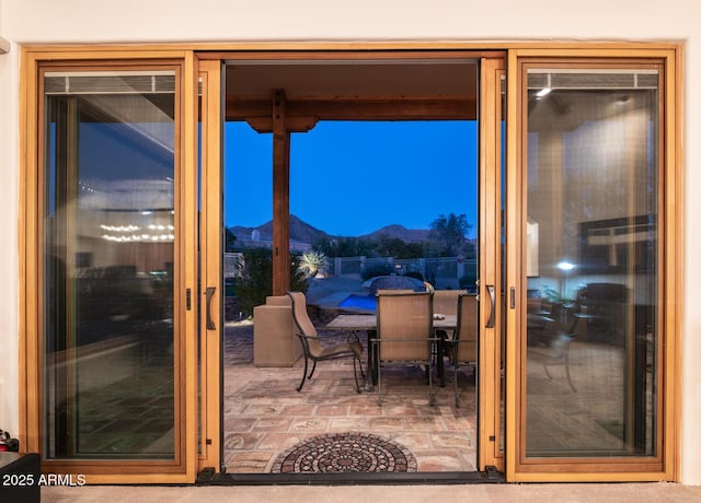 doorway to outside with a mountain view