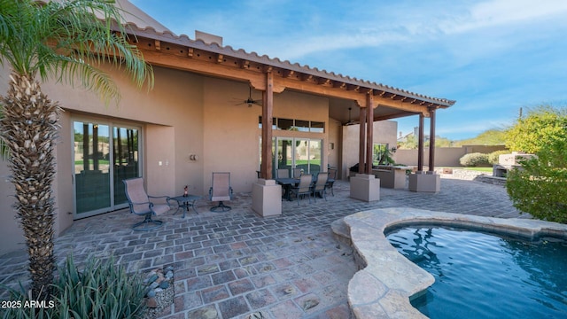 view of patio / terrace featuring an outdoor kitchen and ceiling fan