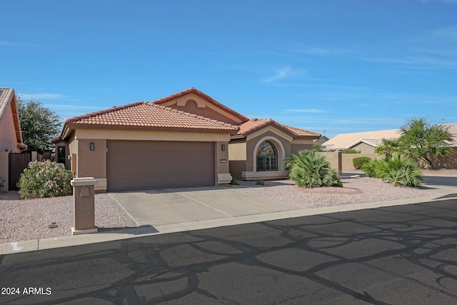 mediterranean / spanish-style home featuring a garage