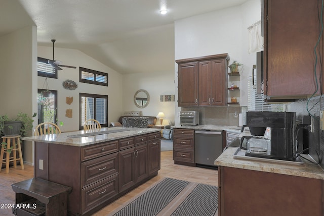 kitchen with tasteful backsplash, ceiling fan, light hardwood / wood-style flooring, dark brown cabinetry, and stainless steel dishwasher