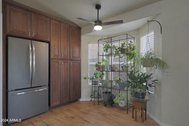 kitchen featuring light hardwood / wood-style flooring, ceiling fan, and stainless steel refrigerator