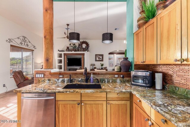 43014 N 12th St, New River, AZ 85087 - kitchen featuring a sink, backsplash, a peninsula, open floor plan, and light stone countertops