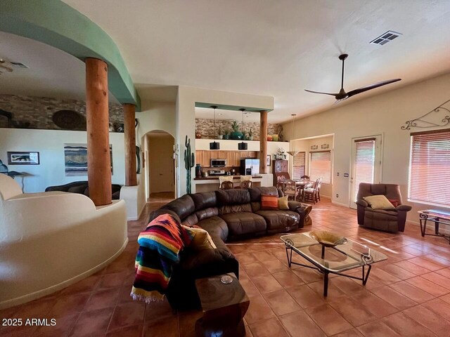 43014 N 12th St, New River, AZ 85087 - tiled living room with arched walkways and ceiling fan
