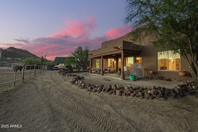 43014 N 12th St, New River, AZ 85087 - back of property at dusk with stucco siding