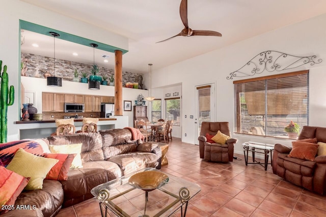 43014 N 12th St, New River, AZ 85087 - living room with a ceiling fan, light tile patterned floors, and recessed lighting