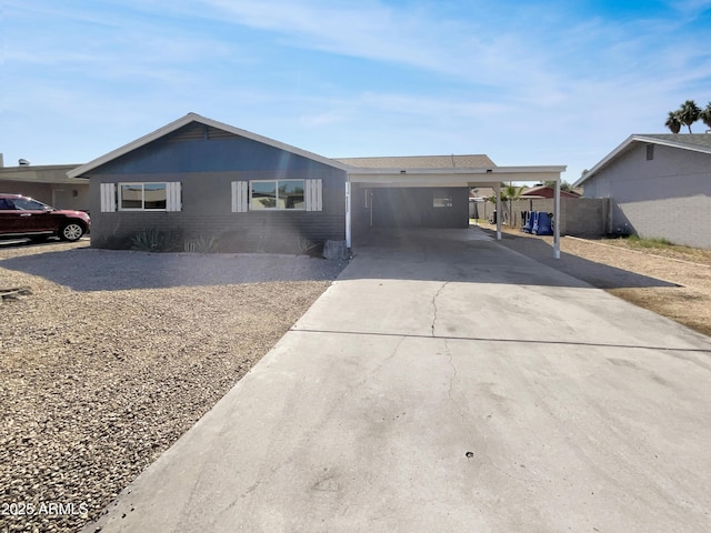 ranch-style home featuring a carport