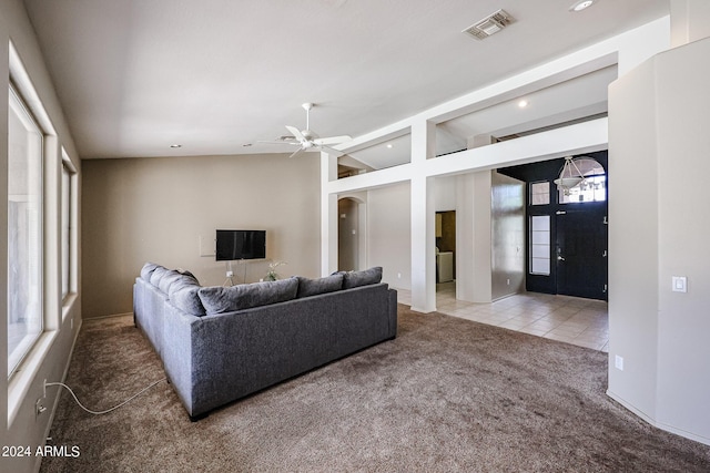 656 W Johnson Dr, Gilbert, AZ 85233 - living room with vaulted ceiling, carpet, tile patterned floors, ceiling fan, and visible vents