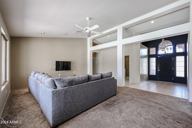 656 W Johnson Dr, Gilbert, AZ 85233 - tiled living room featuring high vaulted ceiling, carpet floors, and a ceiling fan