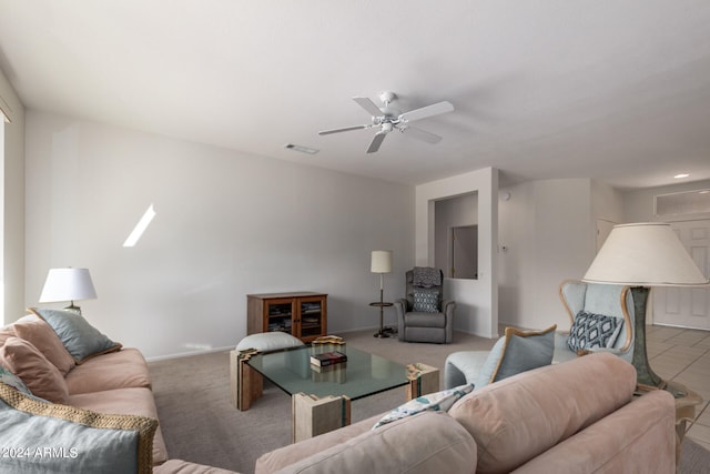 living room featuring light carpet and ceiling fan