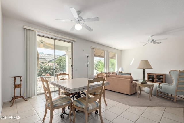 tiled dining room featuring ceiling fan