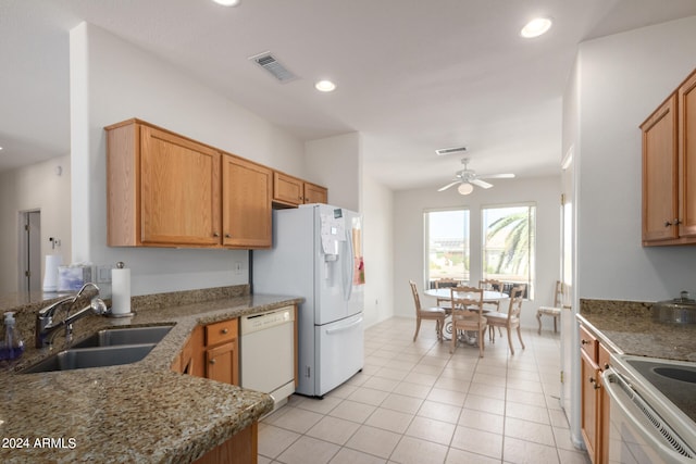 kitchen featuring sink, kitchen peninsula, white appliances, light tile patterned floors, and ceiling fan