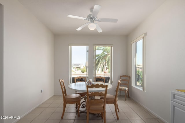 dining room with ceiling fan and light tile patterned floors