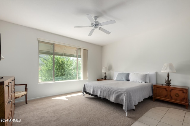 bedroom with light carpet and ceiling fan