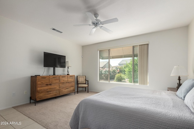 bedroom featuring ceiling fan and light tile patterned floors