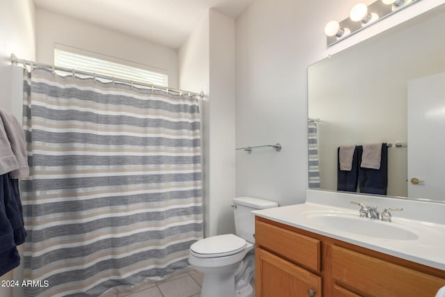 bathroom featuring vanity, toilet, a shower with shower curtain, and tile patterned floors