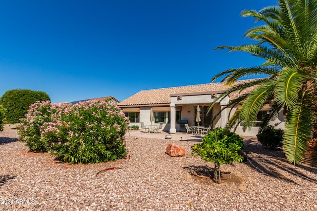 back of house featuring a patio area