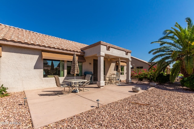 rear view of house featuring a patio