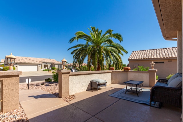 view of patio / terrace with a garage