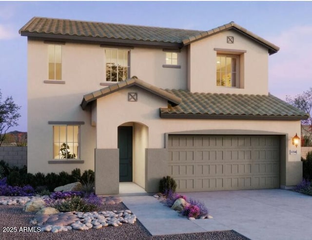 mediterranean / spanish-style house featuring an attached garage, a tile roof, and stucco siding