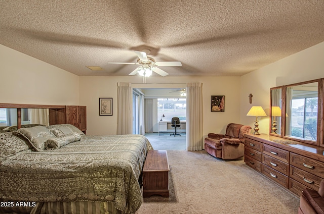 bedroom featuring multiple windows, light colored carpet, a ceiling fan, and access to outside