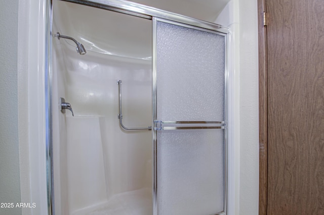 full bathroom featuring a stall shower