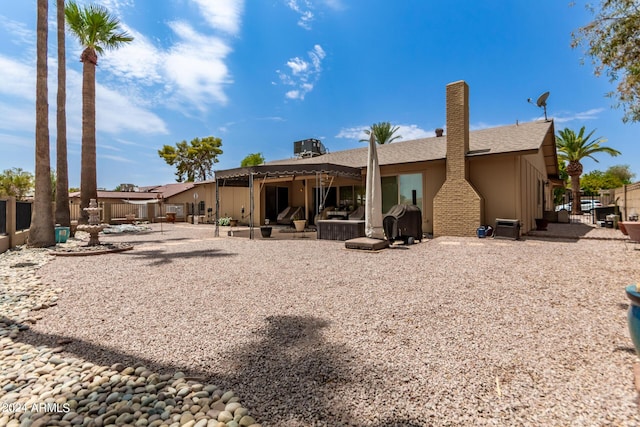 rear view of property featuring a patio area