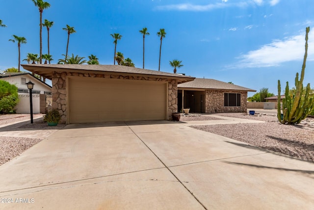 ranch-style home with a garage