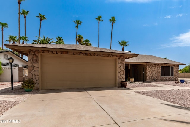 ranch-style home featuring a garage