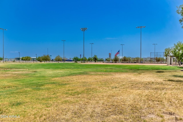 view of home's community featuring a lawn