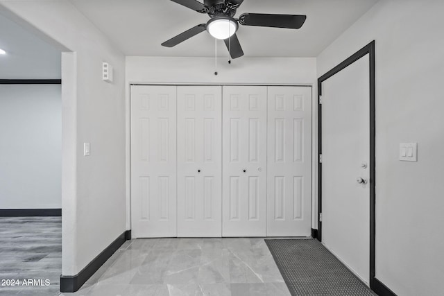 unfurnished bedroom with a closet and ceiling fan