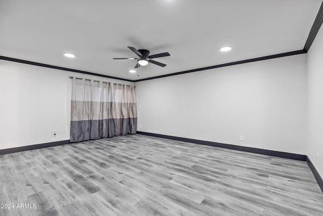 spare room with ceiling fan, ornamental molding, and light hardwood / wood-style flooring