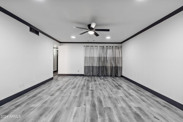 empty room with light hardwood / wood-style flooring, crown molding, and ceiling fan