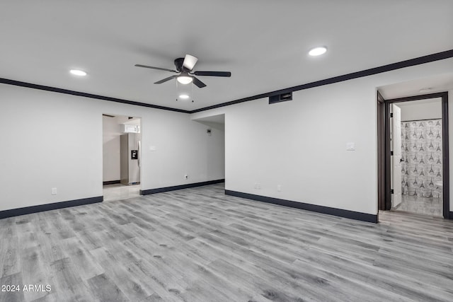 unfurnished room featuring ceiling fan, ornamental molding, and light wood-type flooring