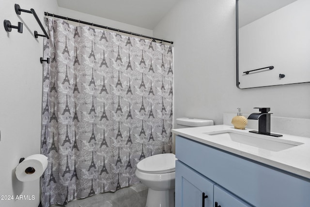 bathroom with vanity, toilet, and walk in shower