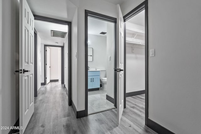 corridor featuring light hardwood / wood-style flooring