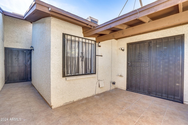 doorway to property with a patio area