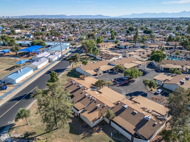 birds eye view of property featuring a mountain view