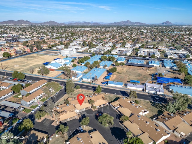 birds eye view of property featuring a mountain view