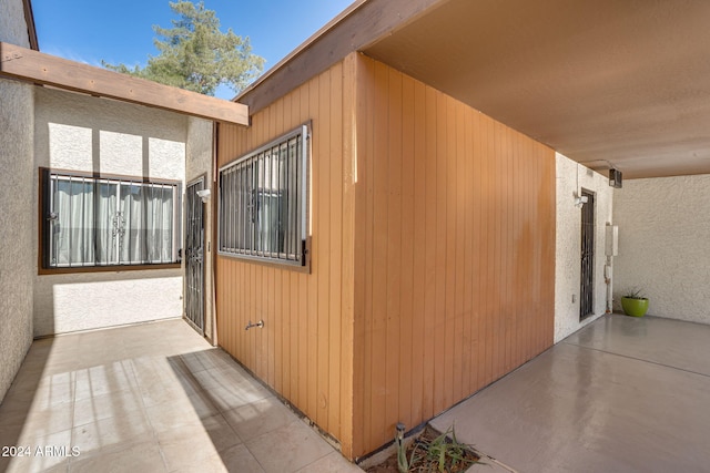 view of side of property featuring a patio