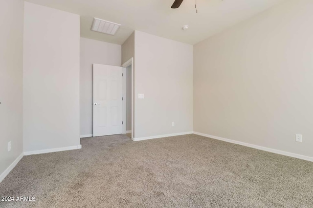 unfurnished room with carpet and ceiling fan