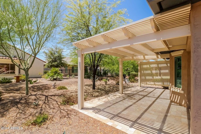 view of patio featuring a pergola