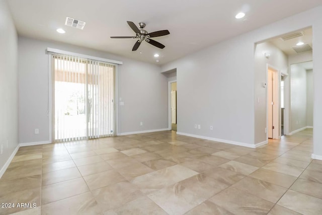 unfurnished room featuring ceiling fan and light tile floors