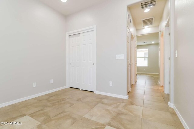 hallway with light tile floors