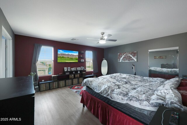 bedroom featuring ceiling fan and light wood-type flooring